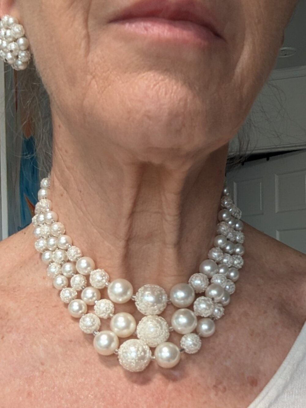 Elegant vintage faux triple strand necklace and earring set